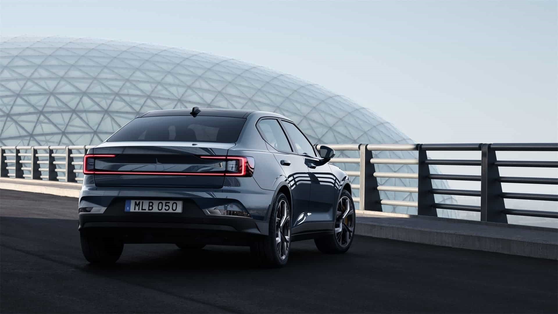 A Berlin-trim Polestar 2 idling on a bridge.